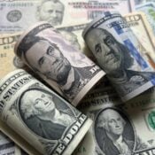 Various paper bills denoting the concept of a loan including cashout loan or HELOC