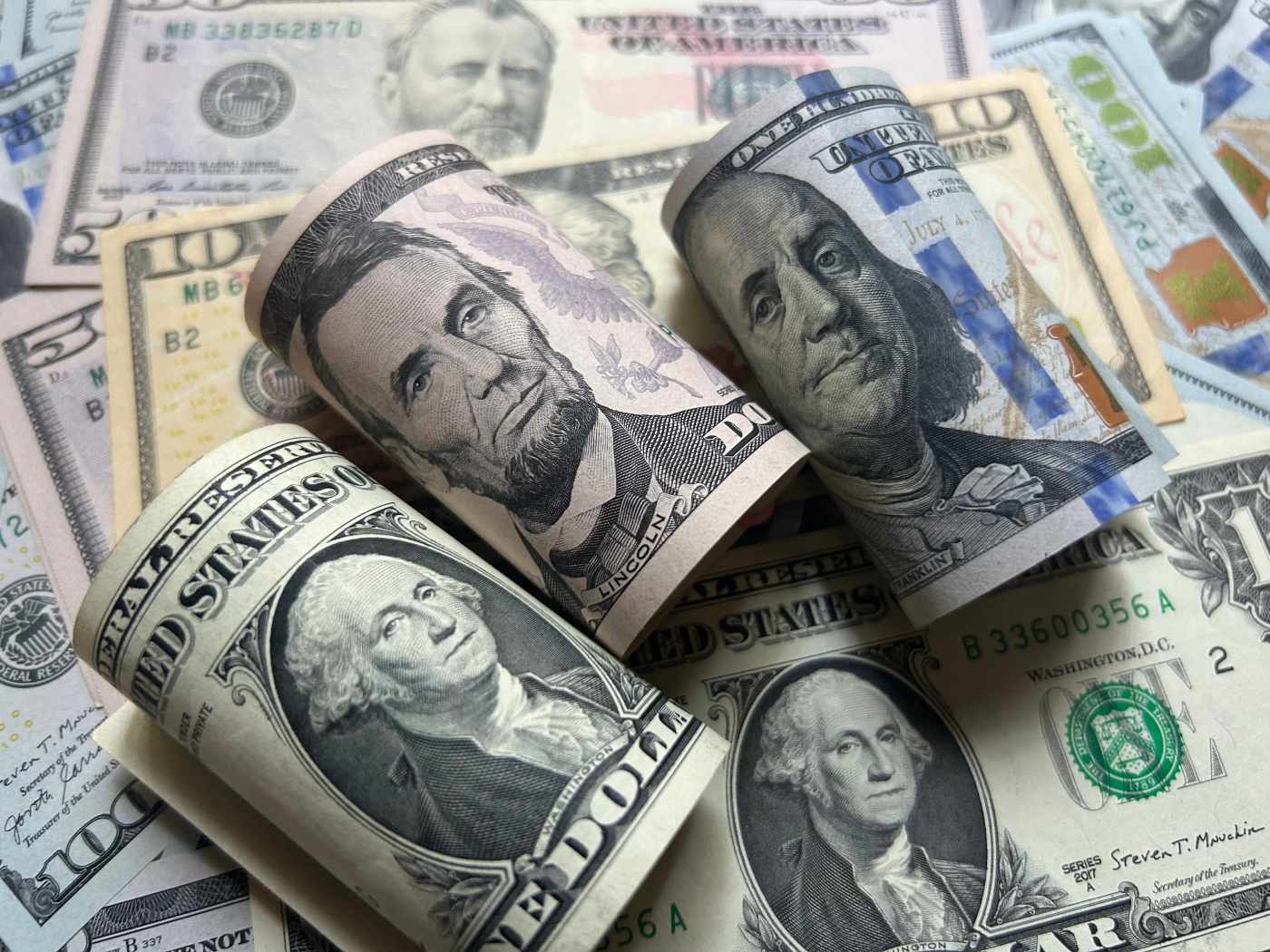 Various paper bills denoting the concept of a loan including cashout loan or HELOC